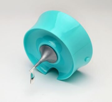 side view of green vortexer lid with silver-plated propeller